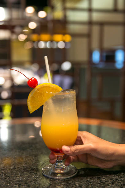 Asian women drinking tequilla sunrise