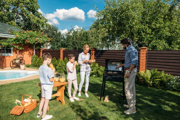 istock family having barbecue together on backyard on summer day 1008570514