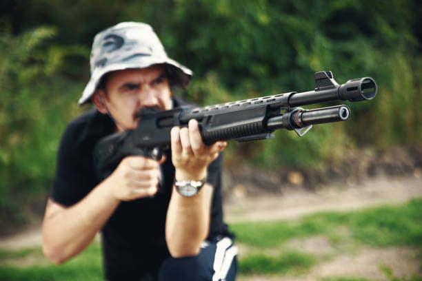 istock Male hunter aiming his rifle and preparing to shoot 1008573332