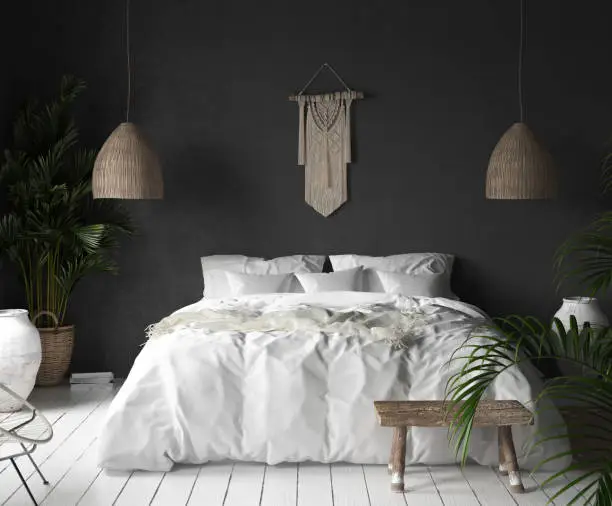 Photo of Bedroom interior with black wall,boho style decor and white bed