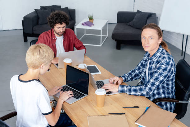 istock young start up team working with digital devices in office 1008581258