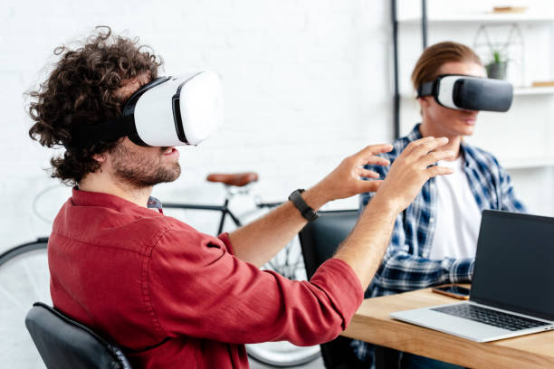 istock young men in virtual reality headsets working together in office 1008581764