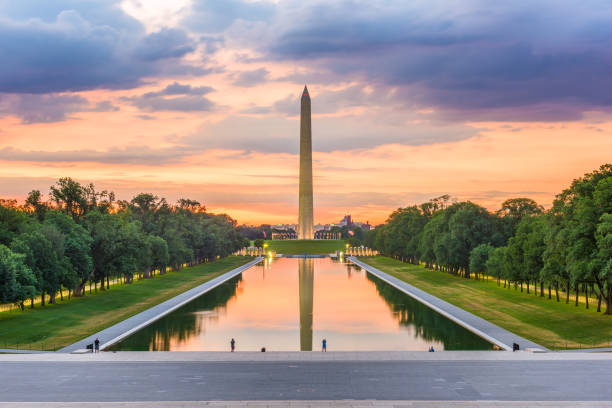 Washington DC, USA Washington Monument on the Reflecting Pool in Washington, D.C. at dawn. national monument stock pictures, royalty-free photos & images