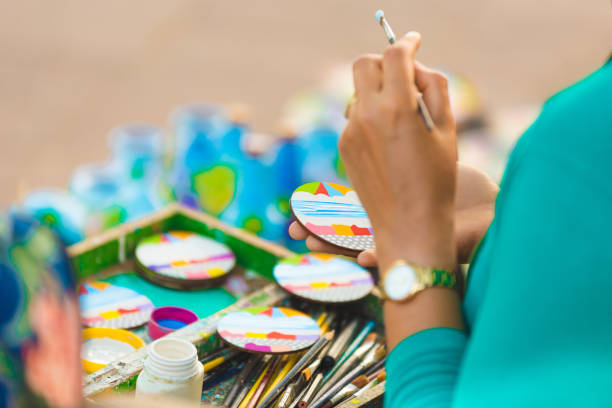 Olinda, Pernambuco, Brazil - January 29, 2018: Brazilian craftsmen paint on ceramics and sell souvenirs on the streets in Olinda city in Pernambuco.