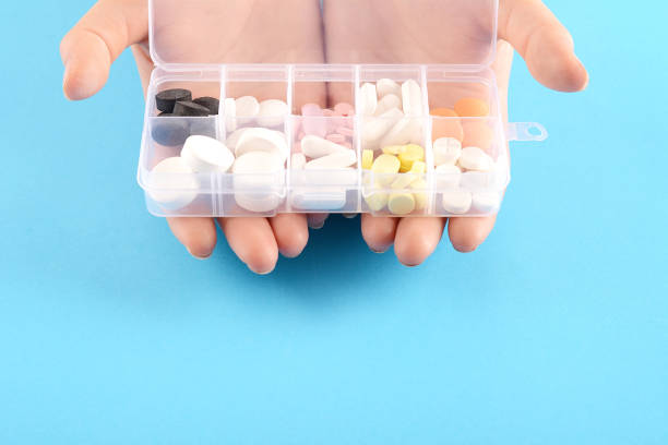 istock hand showing medicine box with pills 1008596336
