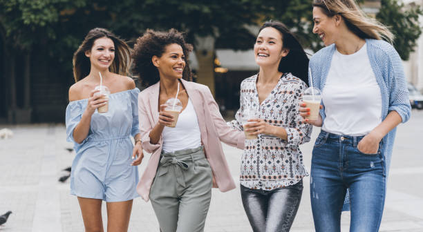 Multiracial group of girlfriends drinking ice coffee