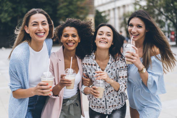 istock Multi-Ethnic Group of friends drinkig ice coffe 1008600118