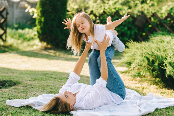 istock mother and happy little daughter having fun together on backyard 1008600476