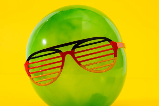 istock Green ballon with fun eyewear 1008600656