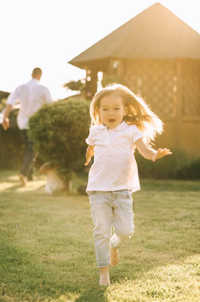 istock happy little kid having fun on yard on summer day 1008600898