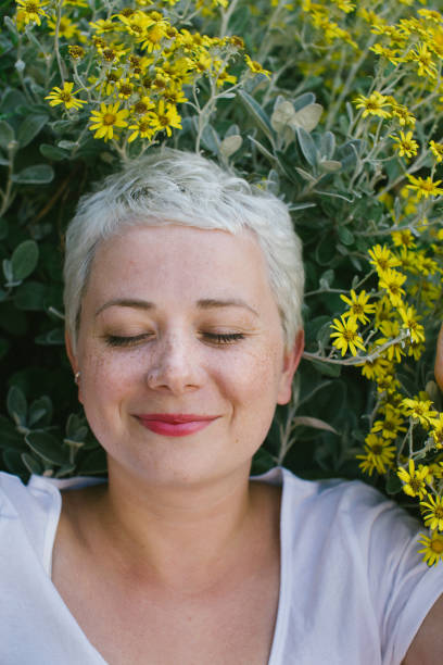 istock summer fun, smiling girl with summer sunflowers 1008621610