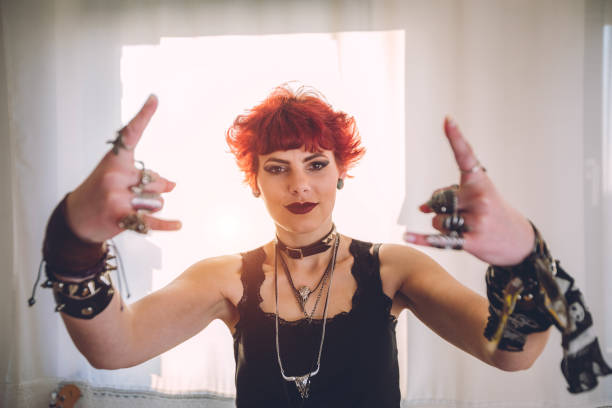 istock Metal girl showing devil horns gesture 1008628988