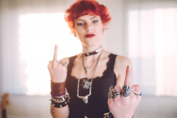 istock Metal girl showing middle finger gesture 1008633536