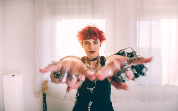 istock Metal girl showing devil horns gesture 1008633748