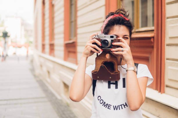 istock Beautiful woman taking photographs on vacation 1008636854