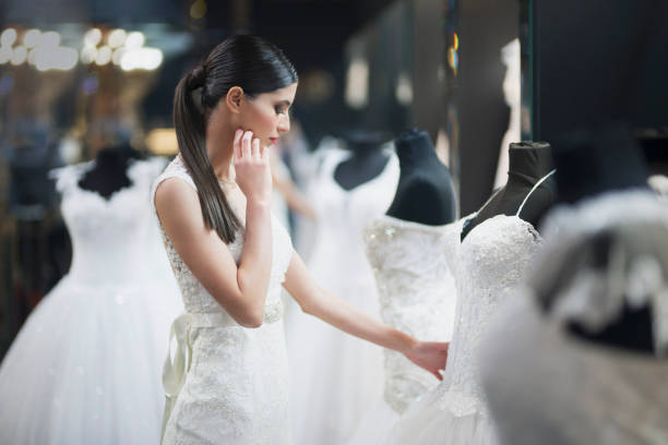 istock Beautiful bride searching for the special dress 1008672470