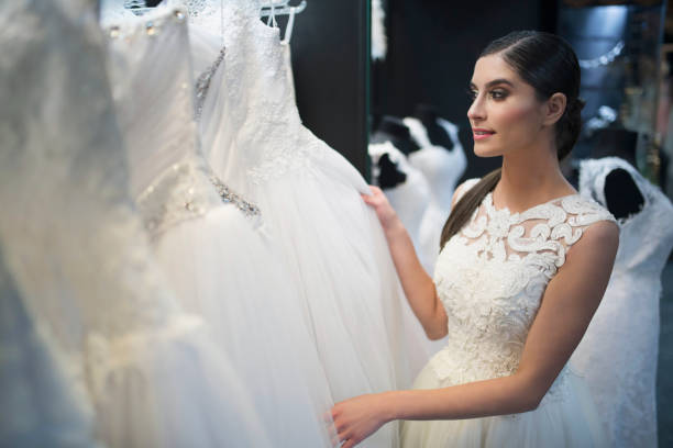 istock Young bride choosing the wedding dress 1008672870