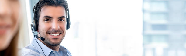 istock Smiling friendly Hispanic man working in call center 1008681498