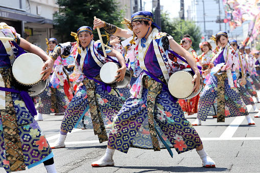 Kagawa, Japan - July 15, 2018: Japanese performers dancing in the famous Yosakoi Festival, yearly free public event. Yosakoi is a unique style of Japanese dance event.
