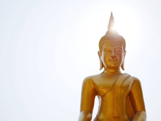 istock The Lord Buddha statue on bright sky and the sun 1008729486