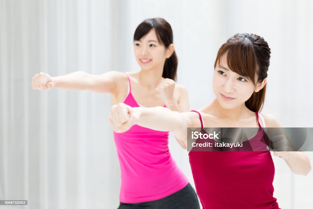 attractive asian woman exersicing Boxing - Sport Stock Photo