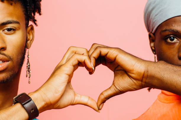 istock Happy love/ Two men making a heart shape with their hands 1008739080