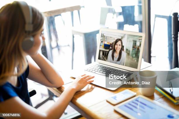 Freelancer With Laptop Working At Cafe Stock Photo - Download Image Now - Telecommuting, Video Conference, Conference Call