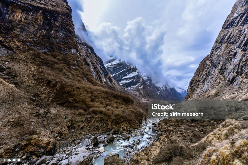 View of Mountains and stream from Machapurchhare base camp(MBC),Nepal,Himalayas. Stream among mountains and landscape,scenics nature. Beauty In Nature Stock Photo