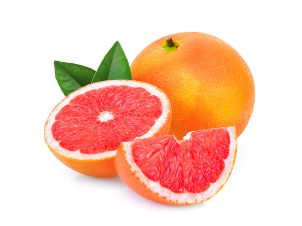 istock whole and slices grapefruit with green leaves isolated on white background 1008772634