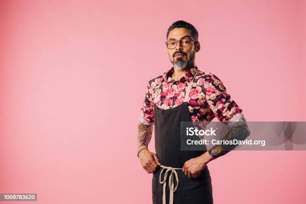 Portrait Of A Cool Cook With Tattoos With Hands On Waist Stock Photo - Download Image Now