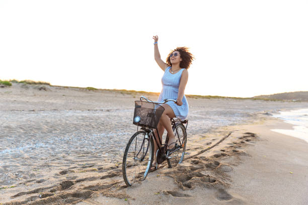 istock Woman enjoying riding on beach 1008794204