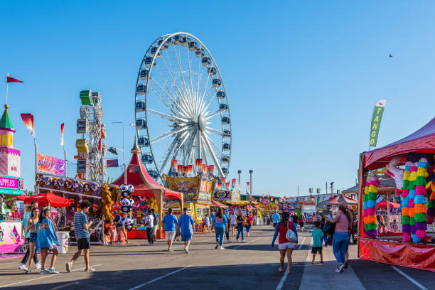 Arizona State Fair People stroll among the games, rides, and concession stands at the Arizona State Fair in Phoenix. traveling carnival photos stock pictures, royalty-free photos & images