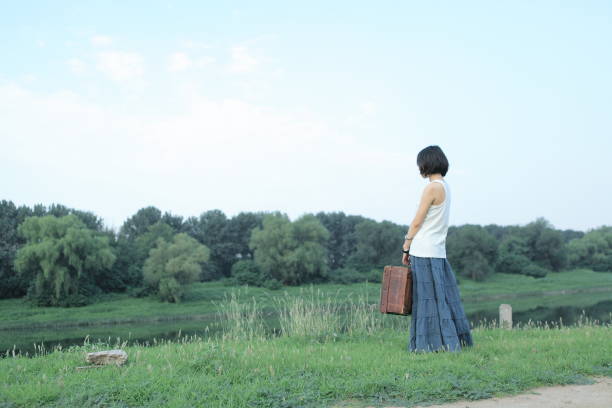 Beautiful Asian woman standing on the grass