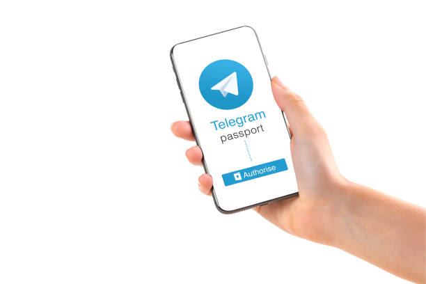 Poltava, Ukraine - July 28, 2018: Telegram application logo on smartphone in hands passport verification new feature stock photo