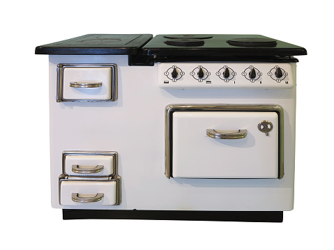 White old vintage retro kitchen stove isolated over white background