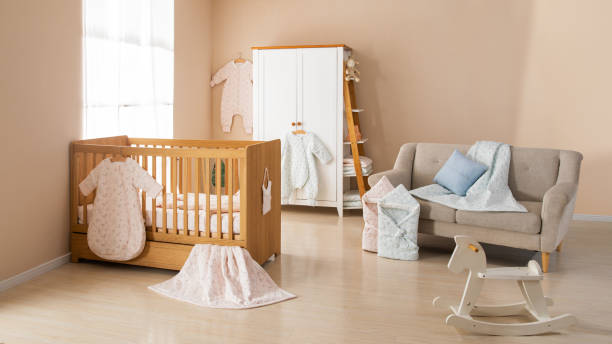 istock Simple, white baby bedroom with cot and rug 1008826144