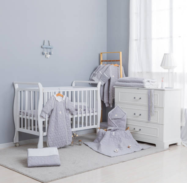 istock Simple, white baby bedroom with cot and rug 1008826194