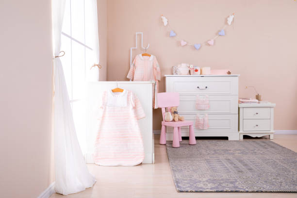 istock Simple, white baby bedroom with cot and rug 1008826248
