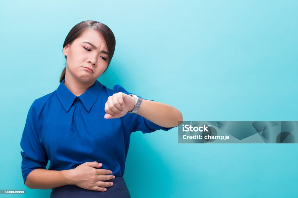 Hungry woman on isolated background Hungry Stock Photo