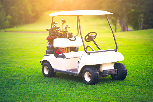Golf cart on golf course is beautiful fairway and layout