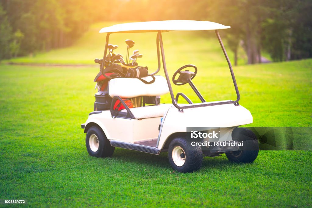 Golf cart on golf course is beautiful fairway and layout Car Stock Photo