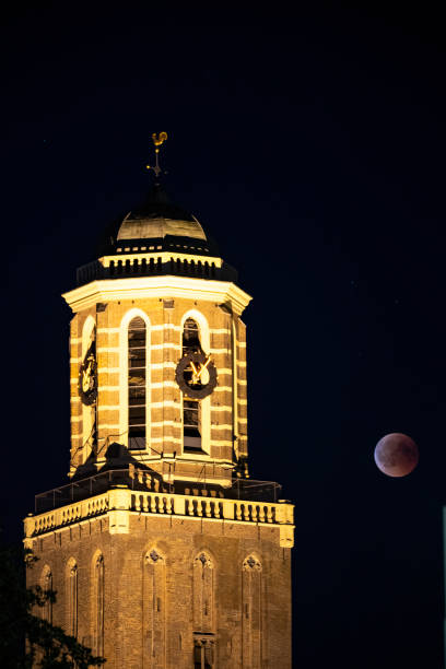 istock Blood moon 2018 with the Peperbus church tower in Zwolle - full Lunar Eclipse 1008840678