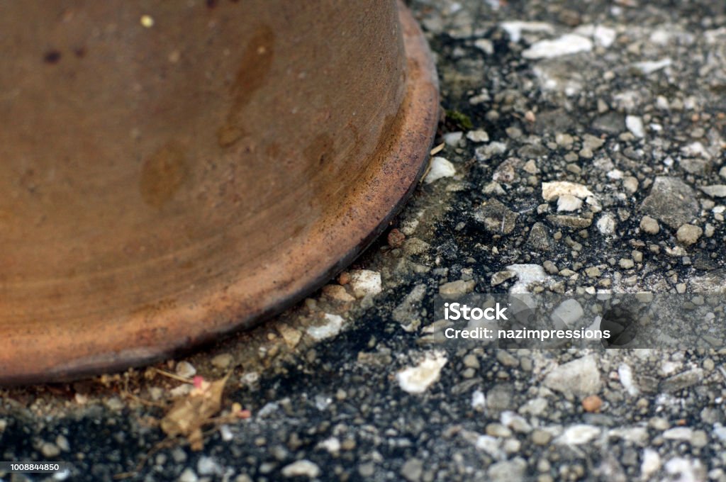 brown vase and a gray block of stone background for web or graphic design projects Art Stock Photo