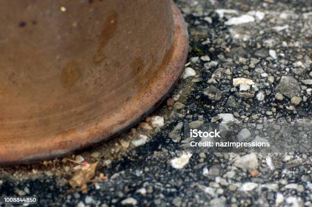 Brown Vase And A Gray Block Of Stone Stock Photo - Download Image Now - Art, Backgrounds, Brick