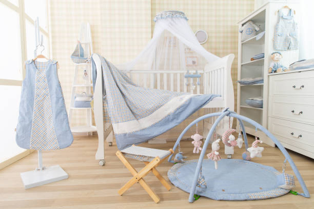 istock Simple, white baby bedroom with cot and rug 1008848046