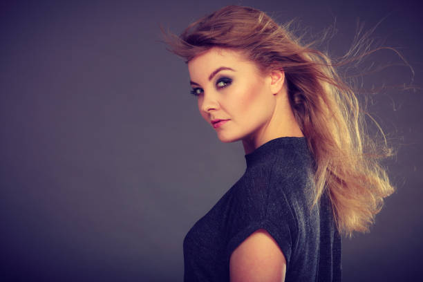 istock Attractive blonde woman with windblown hair 1008851706