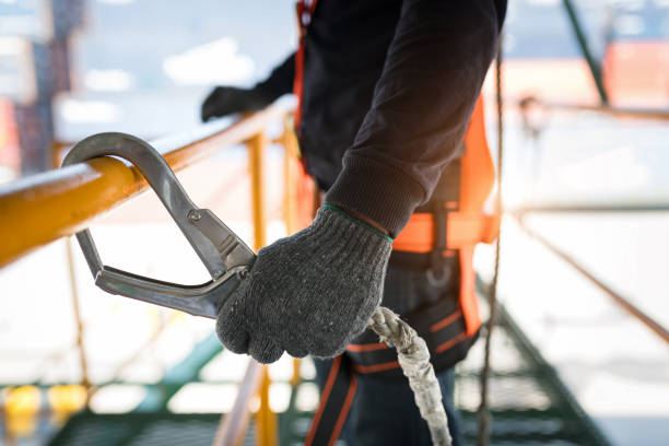 istock Construction worker wearing safety harness and safety line 1008856762