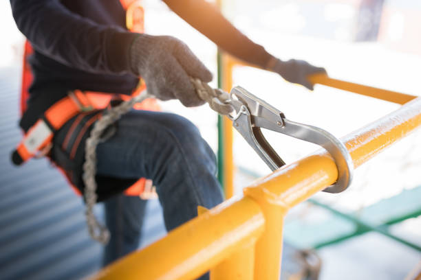 istock Construction worker wearing safety harness and safety line 1008856792