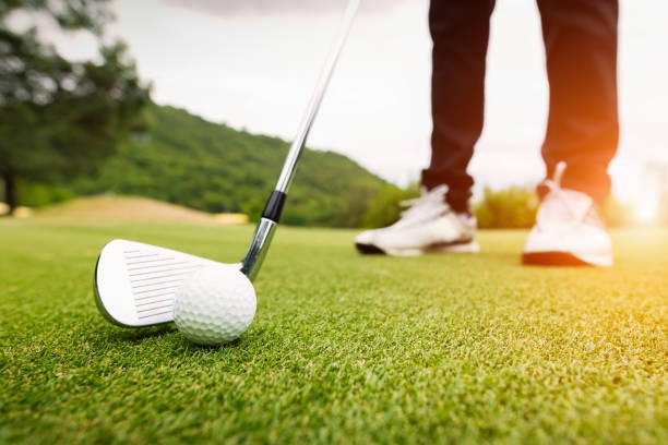 istock Golf ball on green grass ready to be struck at golf club 1008857452