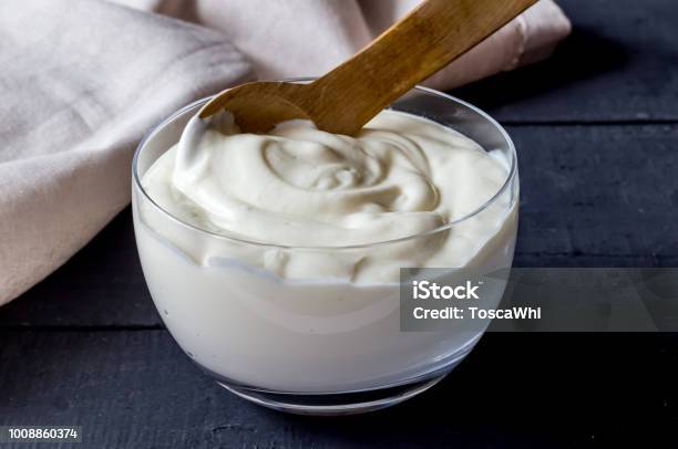 Yogurt In Bowl On Rustic Black Table Photo Of Plain Natural Organic Yoghurt Close Up Stock Photo - Download Image Now